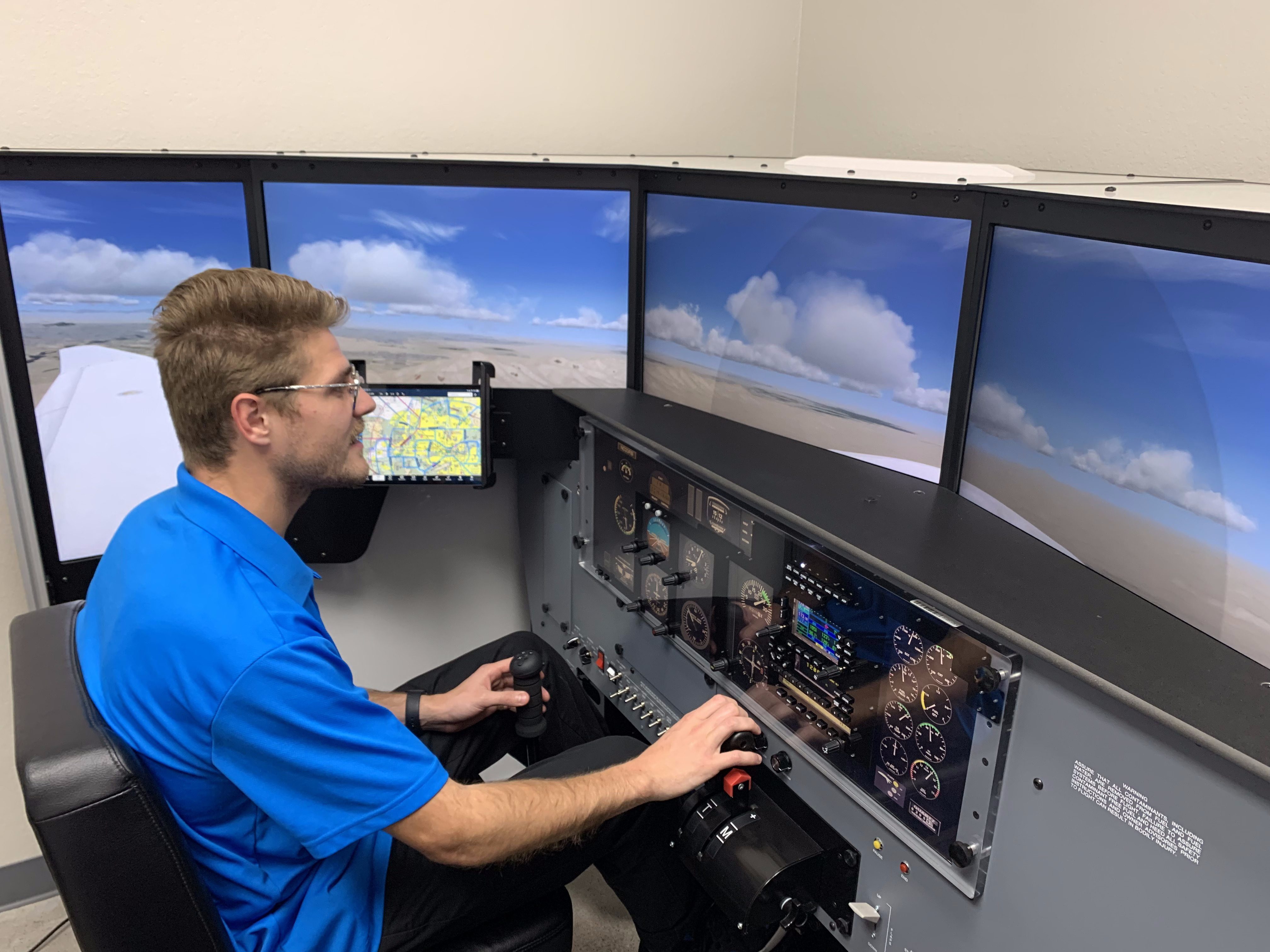 Student training session in the Redbird LD simulator at Fly Eagle Sport
