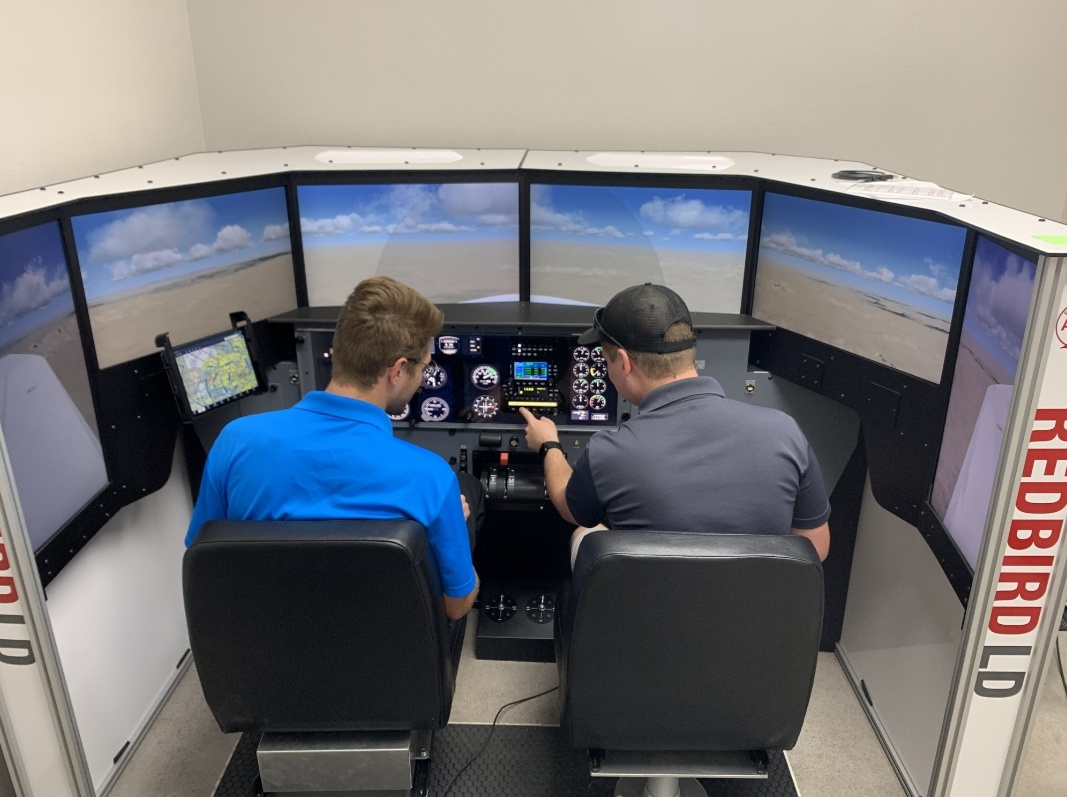 CFI lesson in progress on the Redbird LD simulator at Fly Eagle Sport