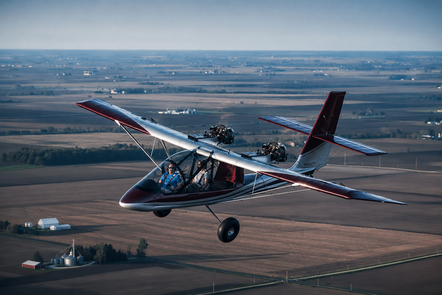 AirCam twin-engine open cockpit aircraft in flight