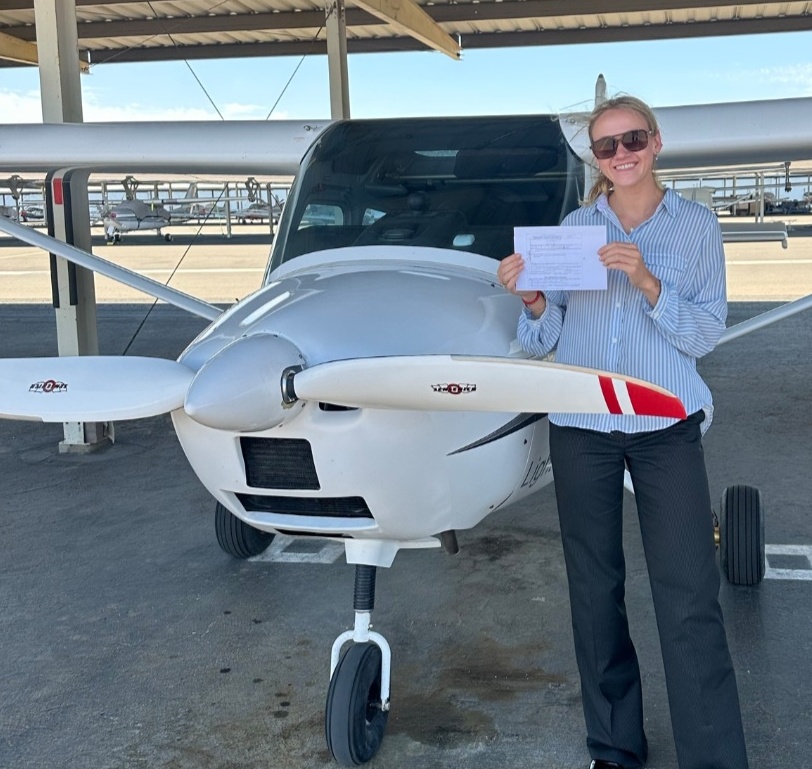 Carly W. after passing her Private Pilot checkride at KGEU — Fly Eagle Sport