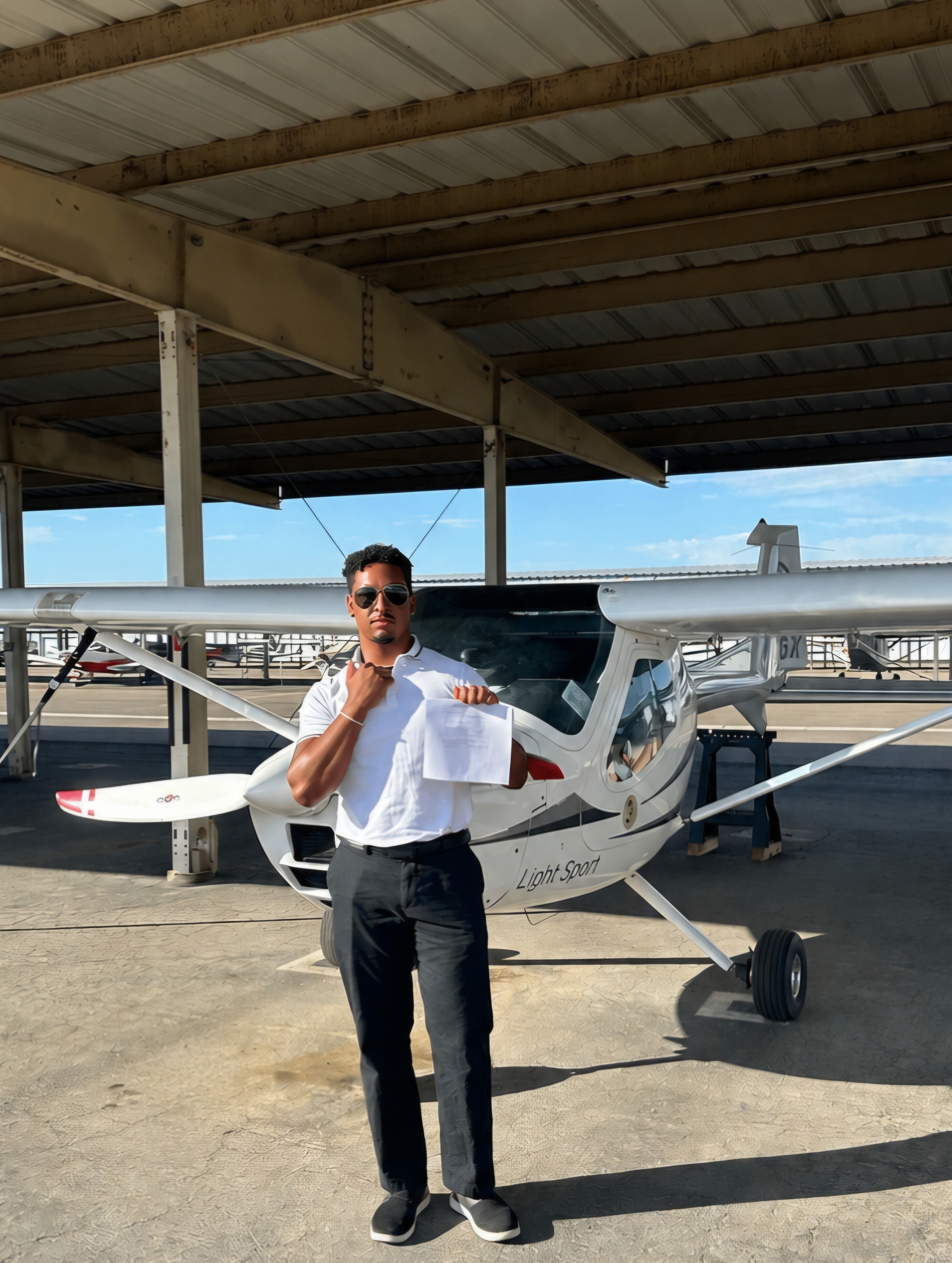 Ty M. after passing his Commercial Pilot checkride at KGEU — Fly Eagle Sport